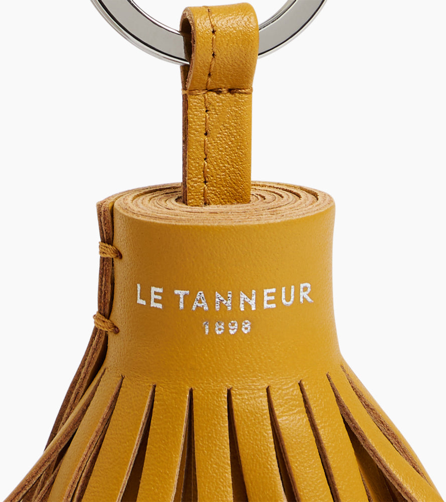 Porte clés pompons en cuir lisse